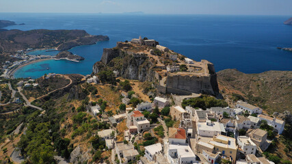 Fototapeta na wymiar Aerial drone photo above iconic medieval castle and main village of Kithira island overlooking beautiful double bay and beach of Kapsali, Kythira island, Ionian, Greece