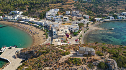 Aerial drone photo of beautiful twin bay, beach and small village of Kapsali  below iconic castle...