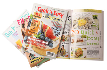 Stack of different magazines on white background, top view