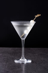 Gibson martini cocktail with onions on black background - obrazy, fototapety, plakaty