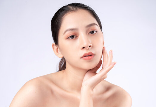 Attractive young Asian woman with youthful skin. Facial care, facial treatment, woman beauty skin isolated on white background. cosmetology, skin beauty and cosmetic concept