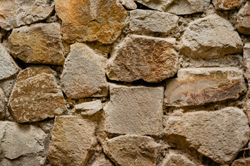 Closeup texture of big stone wall. Rough grunge background