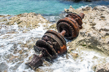 The windlass (1860 ship’s winch) lies on the Ironshore in Cayman Brac. What was once a functional...