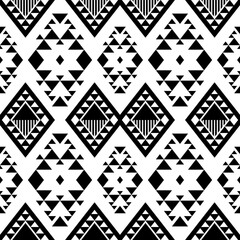 Fototapeta premium black and white seamless ethnic triangle pattern element with geometric shapes design, decorative for printing for background, wallpaper, carpet, floor, curtain, fabric or texture pattern