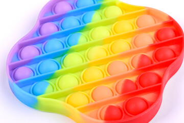 Bright colorful children's toy made of silicone designed to relieve stress