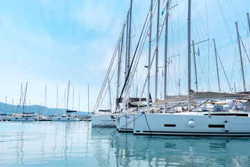Sail yachts moored at the pier.