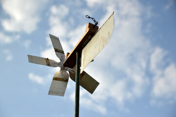 home made wind mill with blue sky in the background