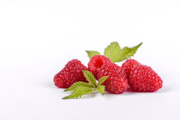 Ripe raspberries with raspberry leaf isolated on a white background