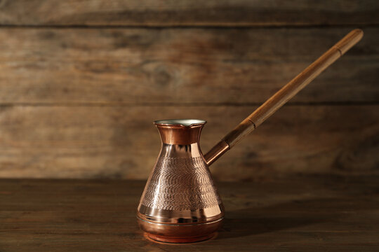 Beautiful Copper Turkish Coffee Pot On Wooden Table