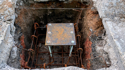 Parts of steel structure were assembled in pit underground. For the foundation of pole.
