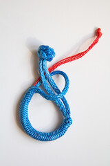 brilliant knot soft shackle woven of blue nylon or polyester rope isolated on white background....