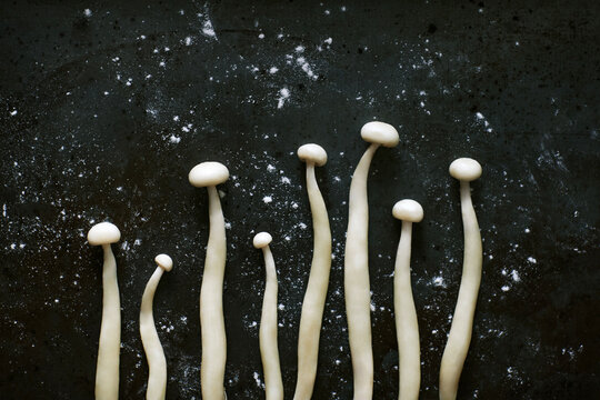 Bunch of enoki mushrooms placed on table