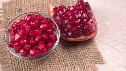 Fresh Pomegranate, rich in natural antioxidants. Concept of red fruits, vitamins and natural antioxidants to the skin for beauty.