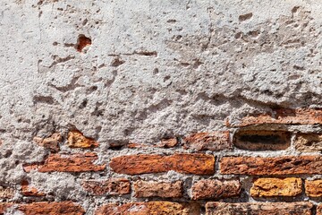 Vintage brown stone brick wall pattern and background seamless