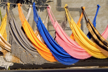 Colorful hammocks ranged on street - Powered by Adobe