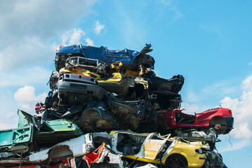 Pile of crushed junk cars on scrapyard