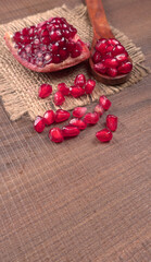 Fototapeta na wymiar Fresh Pomegranate, rich in natural antioxidants. Concept of red fruits, vitamins and natural antioxidants to the skin for beauty.