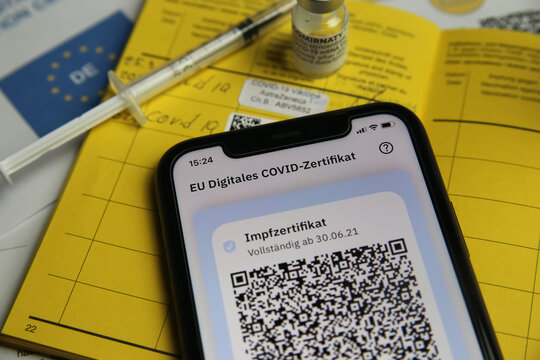 Viersen, Germany - June 24. 2021: Closeup of mobile phone screen with QR-Code of digital covid-19 vaccination certificate covpass app