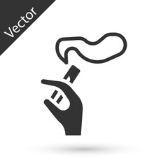 Grey Hand with smoking cigarette icon isolated on white background. Tobacco sign. Vector