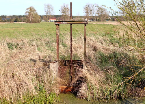 dam-old water damper used to accumulate and stop water flowing from fields and meadows. melioration device
