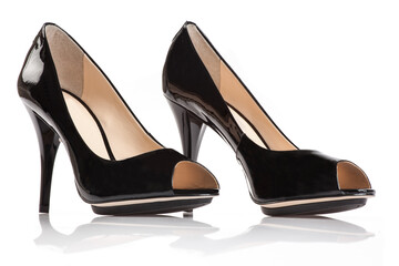 Black patent female shoe on white background.