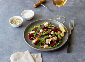 Beetroot salad with cheese, arugula, nuts and honey. Healthy eating. Vegetarian food.