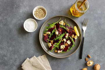 Beetroot salad with cheese, arugula, nuts and honey. Healthy eating. Vegetarian food.