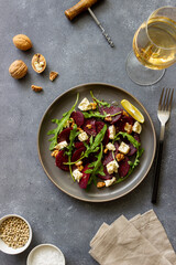 Beetroot salad with cheese, arugula, nuts and honey. Healthy eating. Vegetarian food.