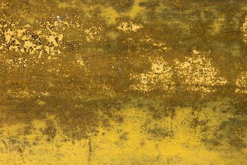 Old yellow wall texture with mold and peeling.
