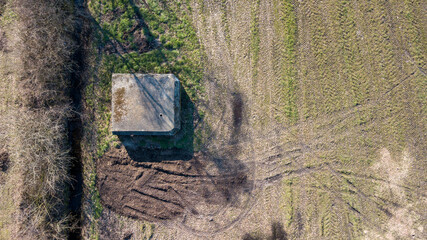 Aerial view from a drone of a brutalist cold gritty concrete world war two, ww2, pillbox war bunker...