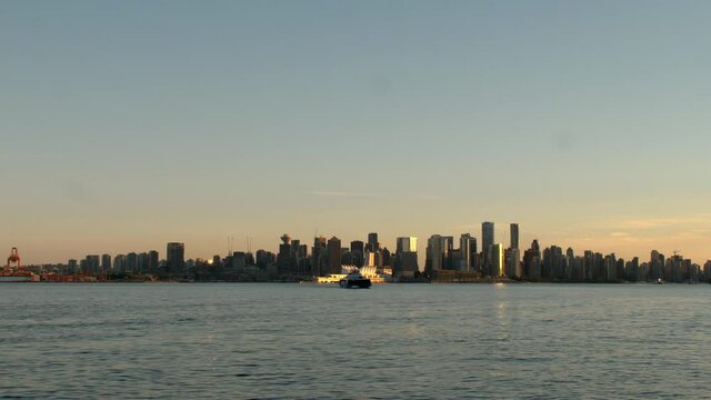 Downtown Vancouver Sunset with City Skyline and Seabus Boat Ship on Coast Harbor Waterfront Shipyards