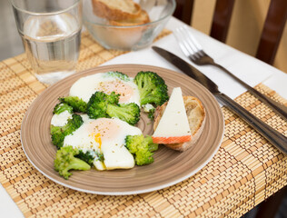 breakfast of crumpled eggs with broccoli
