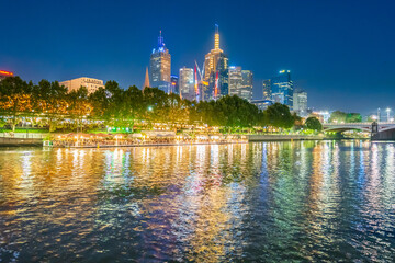 City lights of the Melbourne skyline reflected in the Yarra River