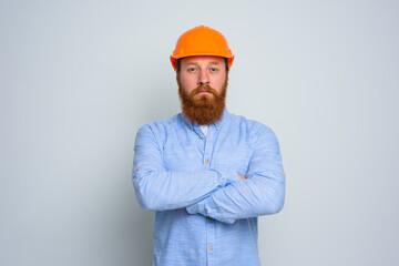 Isolated confidant architect with beard and orange helmet