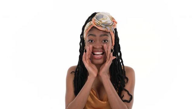 Portrait of a shouting African woman with hands next to mouth. Isolated on a white background.