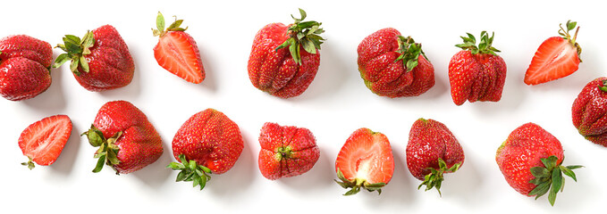 Banner of organic homegrown ugly strawberry on a white background. View from above. Concept eco...