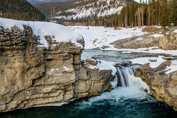 Fototapeta na wymiar Earlu winter around the falls. Elbow Falls Provincial Recreation Area, Alberta, Canada