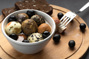 a plate of cheese balls in oil, spicy balper knoll cheese