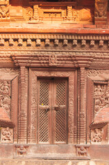 Intricate frond door decoration in Patan, Durbar Square, Kathmandu, Nepal.