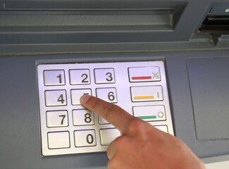 numeric keypad to enter the PIN to access the bank s ATM functions automatically