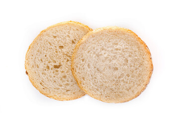 Slices of white bread or a loaf with sesame seeds isolated on a white background.