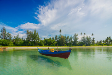 Naklejka na ściany i meble Boat floating in the sea of ​​Bintan island