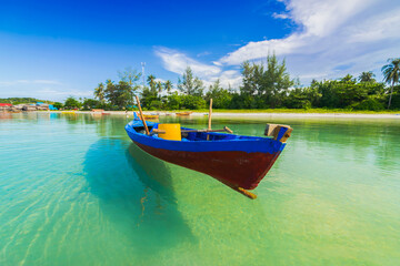 Naklejka na ściany i meble Boat floating in the sea of ​​Bintan island