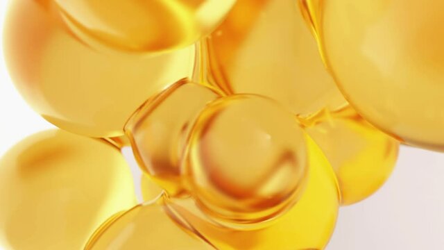 Oil yellow orange abstract background with round golden spheres close up. Footage for trade of vegetable, fish oil or machine.