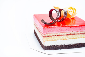 strawberry mousse cake with stacked layers of vanilla cake , chocolate cake and fresh whip cream ,...