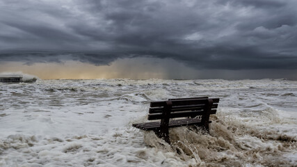 STORMY SEA - The benches on the seashore are flooded with foamy waves