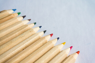 Obraz premium Kid Art education concept. Color pencils on white paper background. copy space