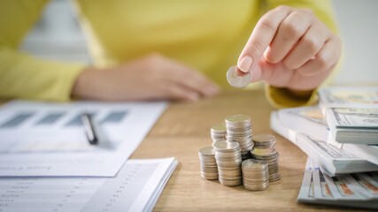 Fototapeta premium Saving money for new home. planning savings money of coins to buy a house concept for property