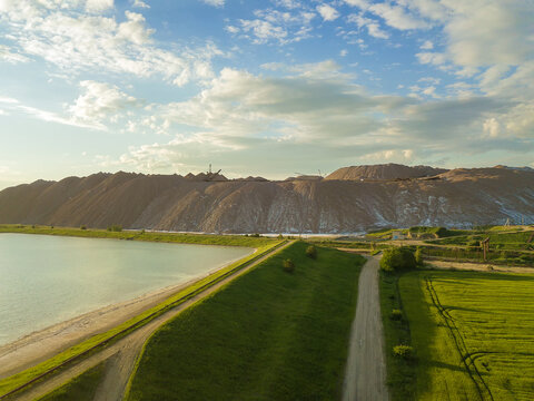 Drone view of the industrial landscape in the salt mountains, Soligorsk landfills at sunset, Belarus
