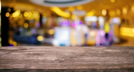 Empty wooden table in front of abstract blurred background of coffee shop . can be used for display or montage your products.Mock up for display of product
